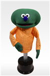 Dome is a green hand puppet with no hair.