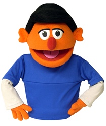 Skip is an orange puppet puppet with black hair.
