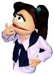 Josie is a female puppet with brown hair and a large pony tail.