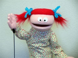 Small people puppet with red pigtails