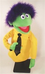 Mardy is a professional hand puppet that measures 16" tall and has green skin and purple boa hair.