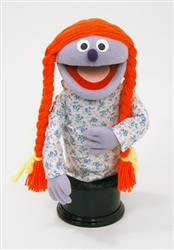 Priscilla is a lavender girl puppet with orange pigtails.