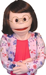 18" tall girl puppet with human wig and glasses and sparkling eyes.