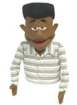 Max is a cocoa skin professional puppet with a black flat top. African American puppet.